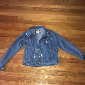 Medium wash, distressed denim jacket.